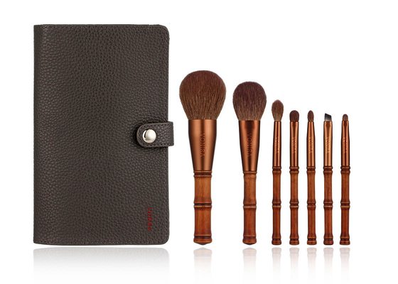 La bellezza Mini Travel Bamboo Makeup Brushes di Vonira ha messo con l'insieme di caso di stoccaggio